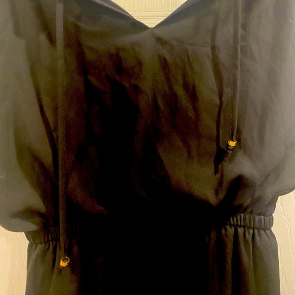 Small black dress by Guess with gold accents and a cinched waist - Picture 2 of 5